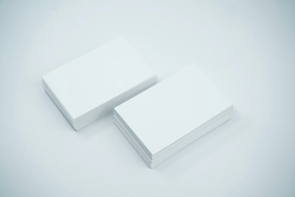 Stack of blank premium business cards ready for NFC encoding and branding