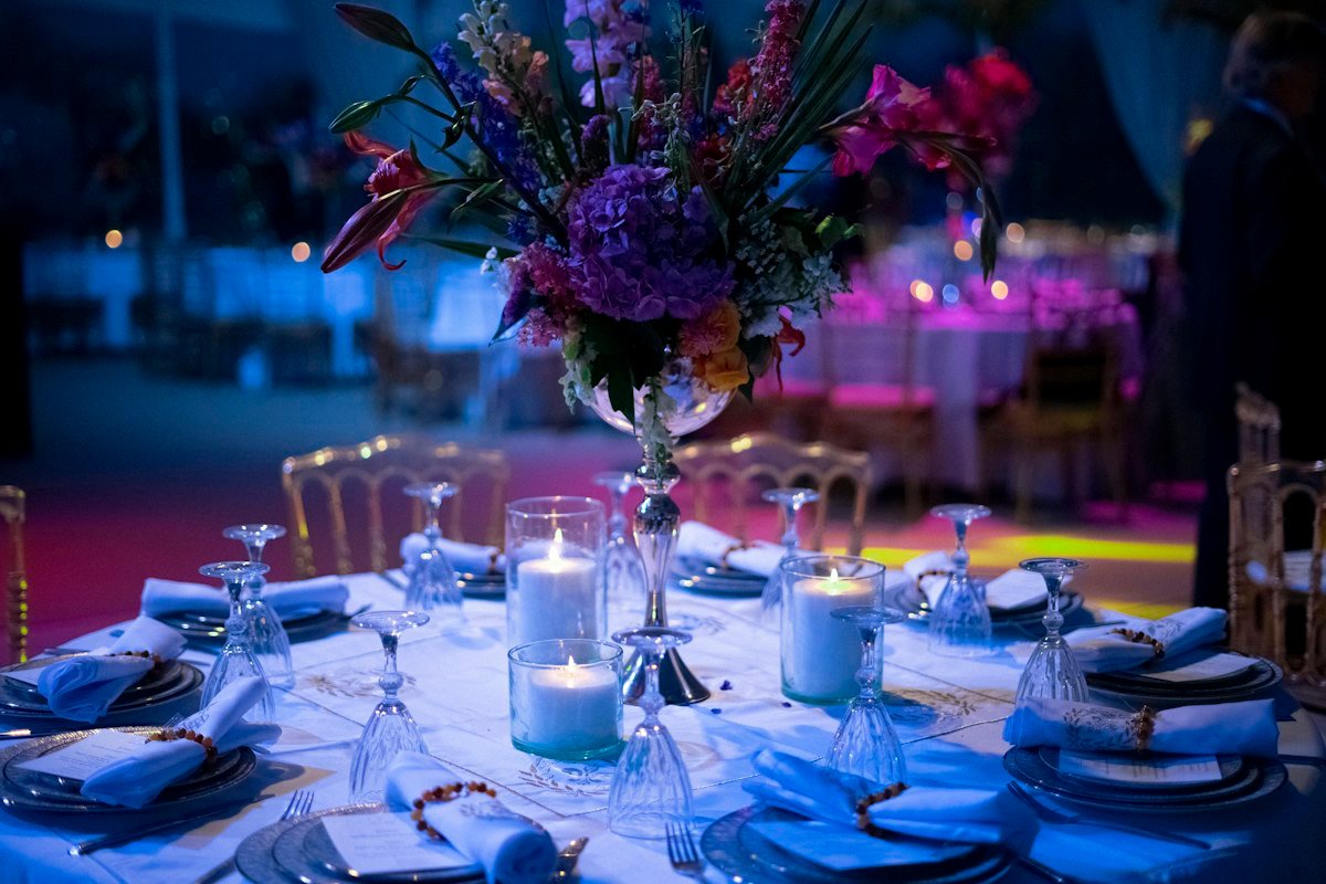 Elegant candlelit reception table set for a wedding
