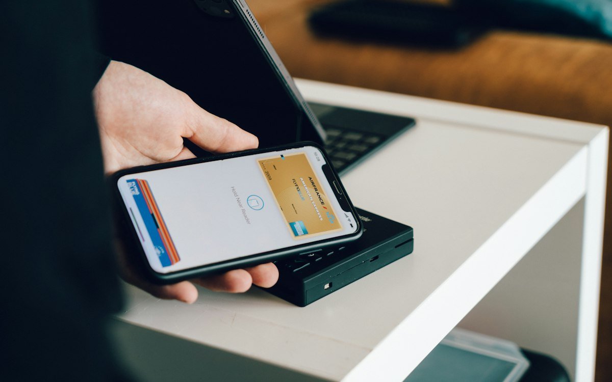 A phone tapping a contactless reader