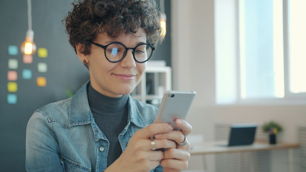 Customer writing a review on a smartphone