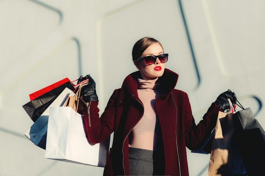 Shopper leaving a store with purchases